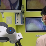 Endomersion: An Immersive Remote Guidance and Feedback System for Robot-Assisted Minimally Invasive Surgery