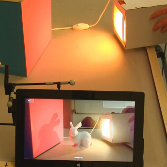 Interactive Near-field Illumination for Photorealistic Augmented Reality on Mobile Devices